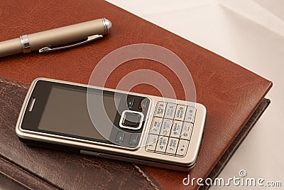 Fragment of diary, mobile phone and pen Stock Photo