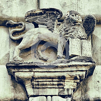 Fragment of facade decor in Lviv - Griffon with book Stock Photo