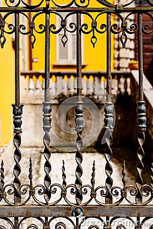 Fragment of a forged fence with curls, waves, sharp elements Stock Photo
