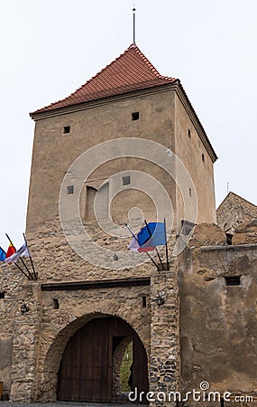 Fragment of the fortress wall with the entrance gates of Rupea Citadel built in the 14th century on the road between Sighisoara an Stock Photo