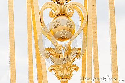 Fragment of the golden gate of the Palace of Versailles Stock Photo