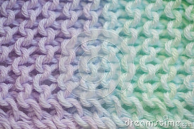 Fragment of handmade seamless knitted patterns in mixed pastel colors closeup Stock Photo