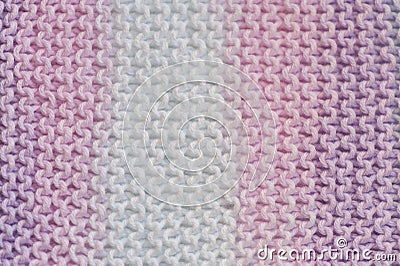 Fragment of handmade seamless knitted patterns in mixed pastel colors closeup Stock Photo