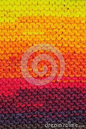 Fragment of handmade seamless knitted patterns in rainbow colors mix Stock Photo