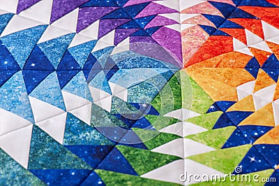 Fragment of hexagon patchwork block like kaleidoscope, detail of quilt, colors of rainbow Stock Photo