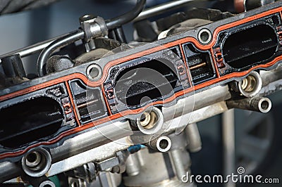 Fragment of the intake manifold from a car engine Stock Photo