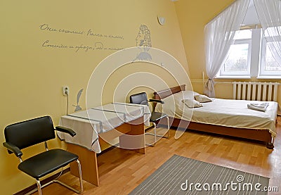 Fragment of an interior of the double hotel room with a portrait of the Russian poet A.S. Pushkin on a wall Stock Photo