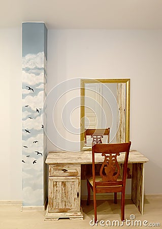 A fragment of the interior of the home office with a desk Stock Photo