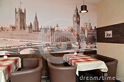 Fragment of an interior of modern cafe with the photo of the Westminster palace on a wall Editorial Stock Photo