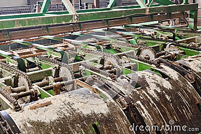 Fragment of a line of sawmill equipment inside a modern lumber mill Stock Photo
