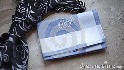 Fragment of a men`s shirt with a tie on floor. men`s tie and handkerchief. Men`s suits dress accessories pocket towel Stock Photo