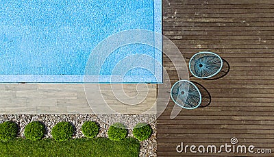 Fragment of modern luxury pool and wooden terrace. Landscaping background. Top view Stock Photo