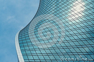 Fragment of a modern office building. Abstract geometric background. Part of a skyscraper with glass windows. Editorial Stock Photo
