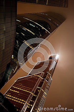 Fragment of Moscow City skyscrapers Federation Towers and Mercury City Tower at misty beautiful night. Moscow International Busin Stock Photo