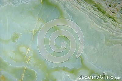 Fragment of natural polished Verde Onyx stone of green color with stains and streaks Stock Photo