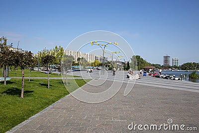 Fragment of a new recreation park on the embankment of the city Editorial Stock Photo