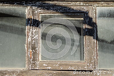 Fragment Old wooden window with dusty glass Stock Photo