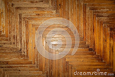 fragment of an old worn wood parquet. Old worn flooring. Stock Photo