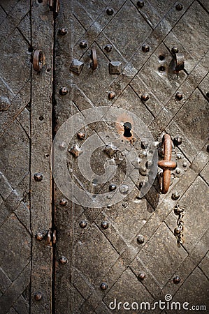 Fragment of the old wrought bronze doors Stock Photo