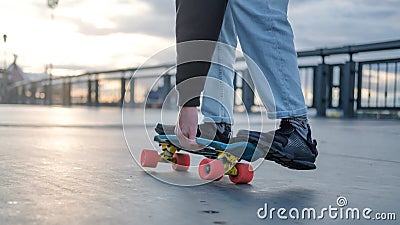 Fragment of a penny board and legs close-up. Stock Photo