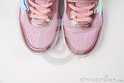 fragment pink shiny sneakers. Stylish fashionable bright shoes for girls Stock Photo