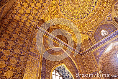 Fragment of a richly decorated wall inside the Sherdor Madrasah on Registan Square in Samarkand. 29.04.2019 Editorial Stock Photo