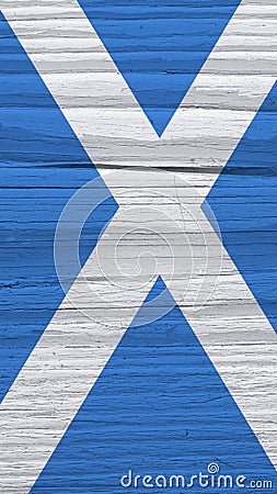Fragment of Scottish flag on a dry wooden surface. Vertical mobile phone wallpaper. Natural background made of old wood with the Stock Photo