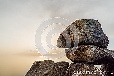 Fragment of stone megalith at sunset Stock Photo