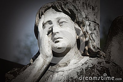 Fragment of vintage statue of a sad ange details Stock Photo