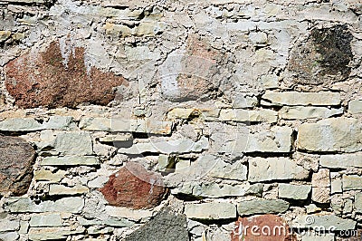 Fragment of wall made of rough uneven stones Stock Photo