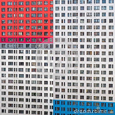 Fragment of a wall with windows of a multi-storey apartment building Stock Photo