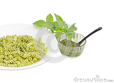 Cooked spiral pasta with pesto and sauce pesto separately Stock Photo