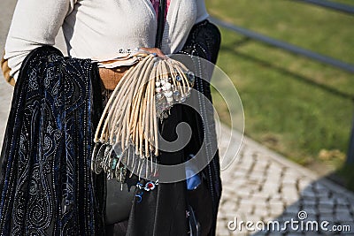 A fragment of a woman`s body with jewelry from a cork in her hand. Copy space Stock Photo