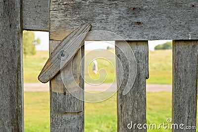 Fragment of a wooden fence with a revolving latch Stock Photo