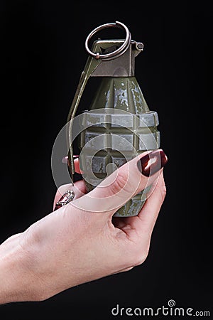fragmentation grenade in girl hand Stock Photo