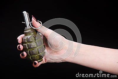 fragmentation grenade in girl hand Stock Photo