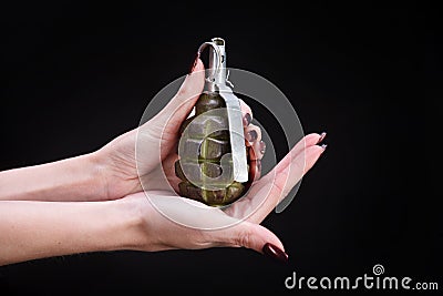 fragmentation grenade in girl hand Stock Photo