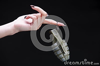 fragmentation grenade in girl hand Stock Photo