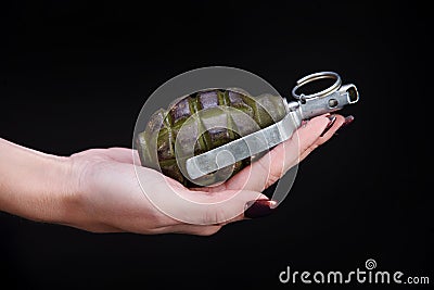 fragmentation grenade in girl hand Stock Photo