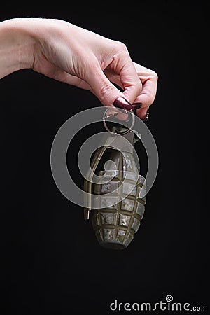 fragmentation grenade in woman hand Stock Photo