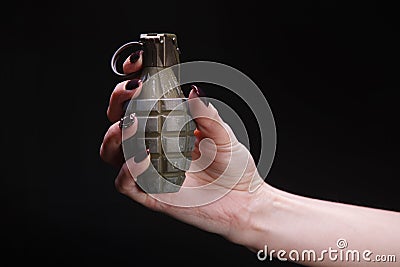 fragmentation grenade in woman hand Stock Photo