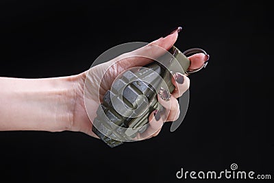 fragmentation grenade in woman hand Stock Photo