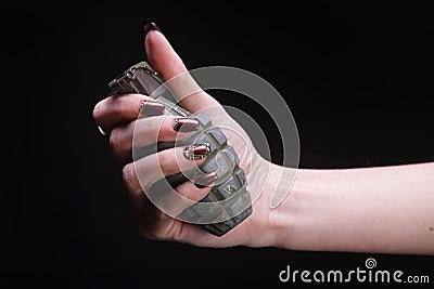 fragmentation grenade in woman hand Stock Photo