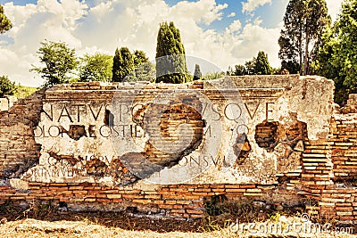 Fragments of marble inscriptions placed on the attic of Porta Romana Stock Photo
