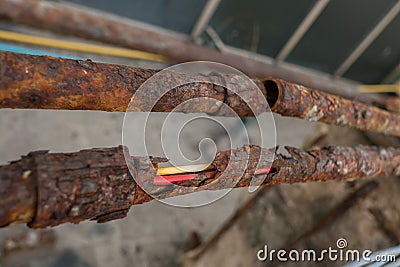 Fragments of old pipes ,metal pipe destroyed. Rusty steel tube Stock Photo
