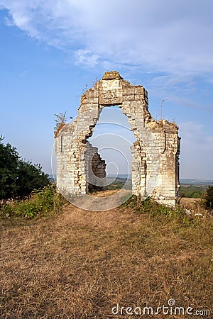 Fragments and remains of the walls of an ancient building subject to destruction under the influence of natural and other factors Stock Photo