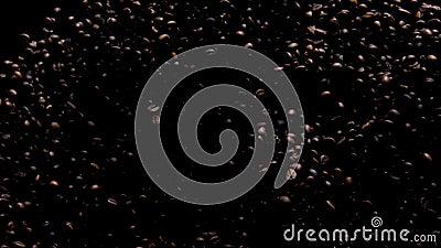 Fragrant coffee grains flying on black background. Exploding aromatic seeds. Stock Photo