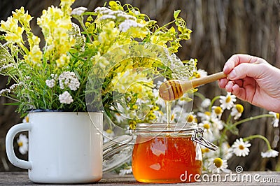 Fragrant, fresh, golden honey in a glass jar. Stock Photo