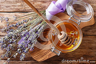 fragrant fresh lavender honey in a glass jar close-up. horizontal top view Stock Photo