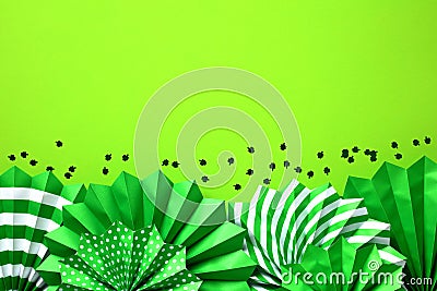 Frame border of green paper fans and confetti. Saint Patricks Day banner design, flyer, party invitation card template Stock Photo